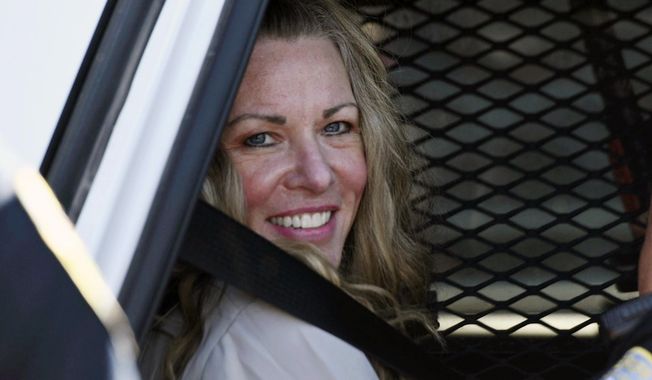 Lori Vallow Daybell sits in a police car after a hearing at the Fremont County Courthouse in St. Anthony, Idaho, on Aug. 16, 2022. The sister of Tammy Daybell, who was killed in what prosecutors say was a doomsday-focused plot, told jurors Friday, April 28, 2023, that her sister&#x27;s funeral was held so quickly that some family members couldn&#x27;t attend. The testimony came in the triple murder trial of Vallow Daybell, who is accused along with Chad Daybell in Tammy&#x27;s death and the deaths of Vallow Daybell&#x27;s two youngest children. (Tony Blakeslee/East Idaho News via AP, Pool, File)