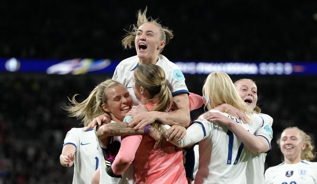 England players celebrate after defeating Brazil 4-2 in a penalty shootout at the end of the Women&#x27;s Finalissima soccer match between England and Brazil at Wembley stadium in London, Thursday, April 6, 2023. The match had ended tied 1-1. (AP Photo/Kirsty Wigglesworth)