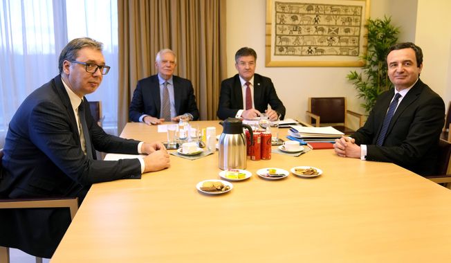 Serbian President Aleksandar Vucic, left, and Kosovo&#x27;s Prime Minister Albin Kurti, right, meet with European Union foreign policy chief Josep Borrell, second left, in Brussels, on Feb. 27, 2023. The leaders of Serbia and Kosovo meet in Brussels on Tuesday May 2, 2023 to continue talks on the implementation of a European Union-backed 11-point plan to normalize ties between the two, but tensions continue to simmer. (AP Photo/Virginia Mayo, File)