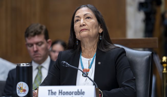 Interior Secretary Deb Haaland listens to criticism from Senate Energy and Natural Resources Committee Chairman Joe Manchin, D-W.Va., as she testifies on President Joe Biden&#x27;s budget request for 2024, at the Capitol in Washington, Tuesday, May 2, 2023. (AP Photo/J. Scott Applewhite)