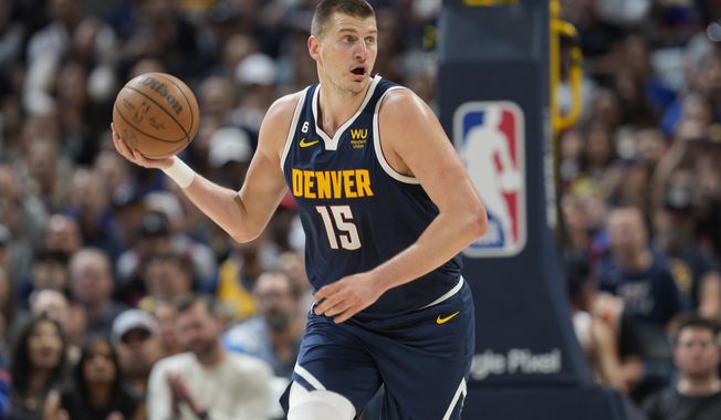 Denver Nuggets center Nikola Jokic picks up the ball in the first half of Game 2 of an NBA second-round playoff series against the Phoenix Suns, Monday, May 1, 2023, in Denver. (AP Photo/David Zalubowski)