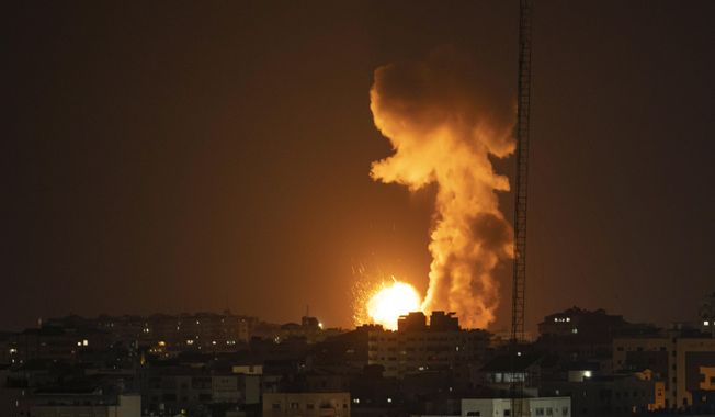 Fire and smoke rise following an Israeli airstrike in northern Gaza Strip, late Tuesday, May 2, 2023. The Israeli military said it had started airstrikes on Gaza targets, in response to earlier rocket salvos from the coastal strip, run by the militant Hamas group. (AP Photo/Fatima Shbair)