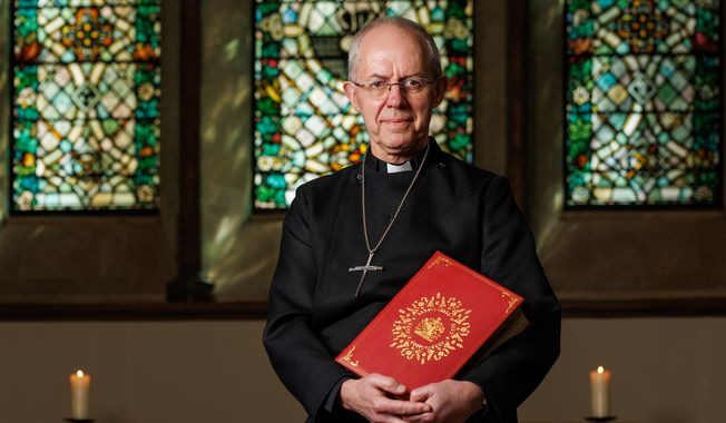 The Archbishop of Canterbury, the Most Revd Justin Welby, holds the Coronation Bible for King Charles III in the chapel at Lambeth Palace.  Photo: Neil Turner for Lambeth Palace, used with permission.