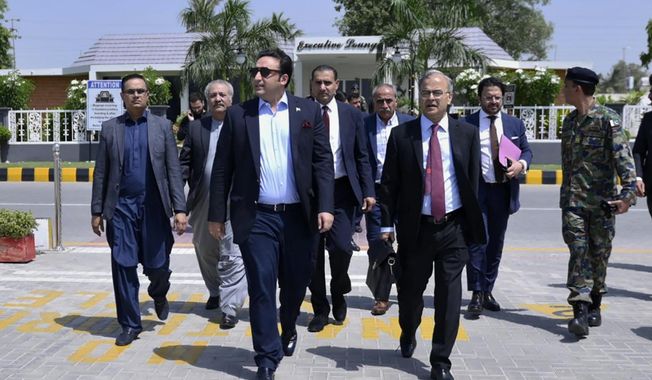 In this photo released by Pakistan&#x27;s Foreign Ministry, Foreign Minister Bilawal Bhutto Zardari, third left, walks with other officials toward his plane to depart for India, in Karachi, Pakistan, Thursday, May 4, 2023. Bhutto departs for India to attend the meeting of Shanghai Cooperation Organization&#x27;s foreign ministers being held in neighboring India&#x27;s state of Goa. (Pakistan Foreign Ministry via AP)