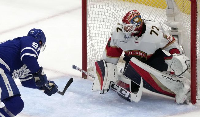 Toronto Maple Leafs center John Tavares (91) skates in on Florida Panthers goaltender Sergei Bobrovsky (72) during the second period in Game 2 of an NHL hockey Stanley Cup second-round playoff series in Toronto, Thursday, May 4, 2023. (Chris Young/The Canadian Press via AP)