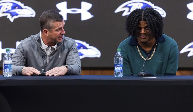 Baltimore Ravens head coach John Harbaugh and quarterback Lamar Jackson speak during a news conference at the NFL football team&#x27;s training center, Thursday, May 4, 2023, in Owings Mills, Md. (AP Photo/Julia Nikhinson)