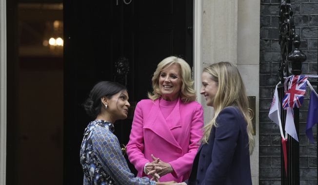 Akshata Murty wife of the British Prime Minister greets Finnegan Biden the the granddaughter of US First Lady Jill Biden, on the doorstep of 10 Downing Street in London, Friday, May 5, 2023. The First Lady is in London to attend the Coronation of King Charles III, on Saturday May, 6.(AP Photo/Kin Cheung)