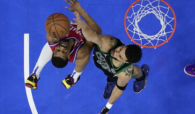 Philadelphia 76ers&#x27; De&#x27;Anthony Melton goes up to shoot against Boston Celtics&#x27; Jayson Tatum during the second half of Game 3 in an NBA basketball Eastern Conference semifinals playoff series, Friday, May 5, 2023, in Philadelphia. (AP Photo/Matt Slocum)