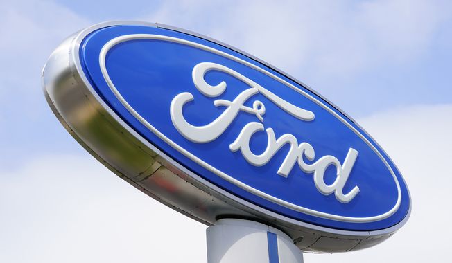 A Ford sign is shown at a dealership in Springfield, Pa., Tuesday, April 26, 2022. (AP Photo/Matt Rourke, File)