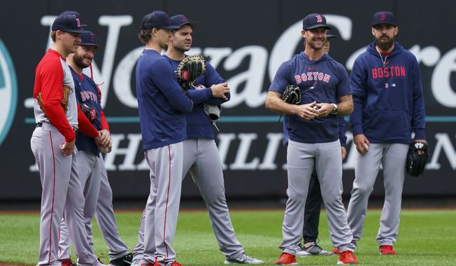 Boston Red Sox players look on prior to a baseball game against the Philadelphia Phillies, Friday, May 5, 2023, in Philadelphia. (AP Photo/Chris Szagola)