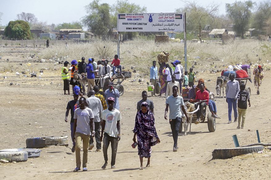 People who crossed from Sudan are seen at a refugee camp in Renk County, South Sudan, Wednesday, May 3, 2023. Sudan has plunged into chaos since fighting erupted in mid-April between the country's two rival top generals and there is increasing concern for those trapped and displaced by the fighting. (Peter Louis/WFP via AP)