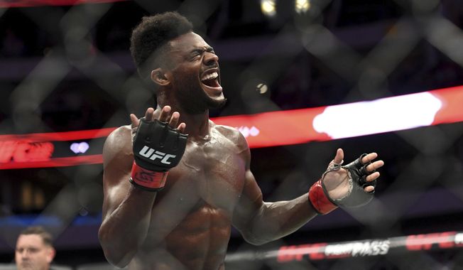 Aljamain Sterling celebrates after defeating Cody Stamann in their bantamweight mixed martial arts bout at UFC 228 on Saturday, Sept. 8, 2018, in Dallas. Former two-division world champion Henry Cejudo fights for the bantamweight title bout against reigning champion Aljamain Sterling. The are the main event of UFC 288 on Saturday at the Prudential Center in Newark, N.J. (AP Photo/Jeffrey McWhorter, File)
