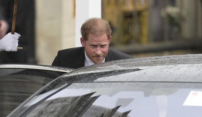 Britain&#x27;s Prince Harry departs Westminster Abbey after the coronation ceremony of King Charles III and Queen Camilla, in London Saturday, May 6, 2023. (AP Photo/Kin Cheung)