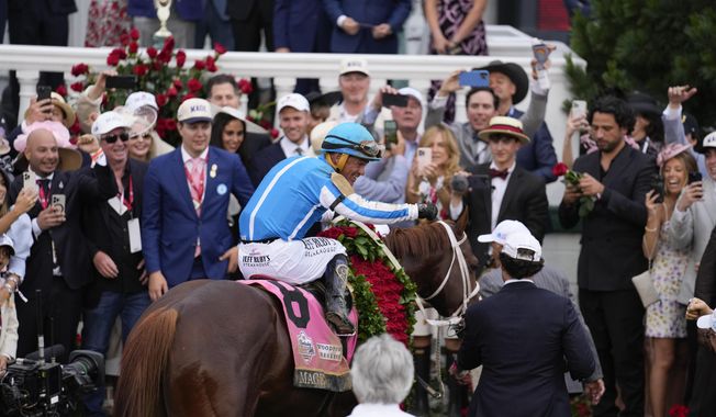 Javier Castellano, atop Mage, reacts in the winner&#x27;s circle after winning the 149th running of the Kentucky Derby horse race at Churchill Downs Saturday, May 6, 2023, in Louisville, Ky. (AP Photo/Jeff Roberson)