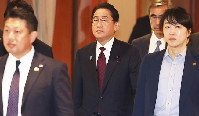Japanese Prime Minister Fumio Kishida, center, leaves after meeting with business leaders at a hotel in Seoul, South Korea, Monday, May 8, 2023. (Seo Dae-yeon/Yonhap via AP)