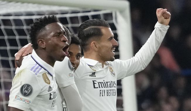Real Madrid&#x27;s Rodrygo, second from right, celebrates with teammates after scoring his side&#x27;s second goal during the Champions League quarterfinal second leg soccer match between Chelsea and Real Madrid at Stamford Bridge stadium in London, Tuesday, April 18, 2023. (AP Photo/Kirsty Wigglesworth)