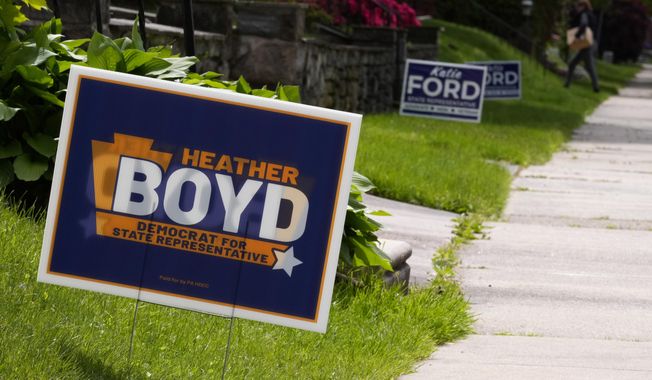 Campaign signs for Heather Boyd and Katie Ford are seen, Thursday, May 4, 2023, in Aldan, Pa. The two are running in a special election in the Philadelphia suburbs that will determine whether Democrats in the Pennsylvania House of Representatives will maintain control of the chamber or if Republicans will reclaim the majority control they held for 12 years until this January. (AP Photo/Matt Slocum)