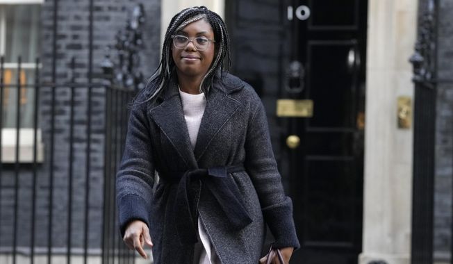 Kemi Badenoch, Britain&#x27;s Secretary of State for International Trade and President of the Board of Trade, Minister for Women and Equalities leaves after attending a cabinet meeting in Downing Street in London, on Jan. 17, 2023. The U.K. government on Wednesday May 10, 2023 scrapped plan to remove all remaining EU laws, some 4,000 in all, from British statute books by the end of this year — a post-Brexit goal that critics said was rash and unachievable. Badenoch said in a written statement that the government would instead draw up a list of about 600 specific laws that would be revoked. (AP Photo/Kirsty Wigglesworth, File)