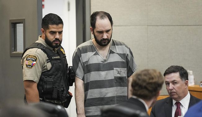 Daniel Perry enters the 147th District Courtroom at the Travis County Justice Center for his sentencing, Tuesday, May 9, 2023, in Austin, Texas. (Mikala Compton/Austin American-Statesman via AP)