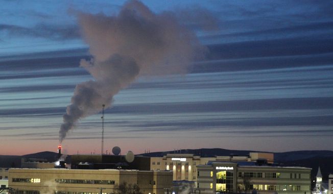A plume of smoke being emitted into the air from a power plant, Feb. 16, 2022, in Fairbanks, Alaska.  The Biden administration is proposing new limits on greenhouse gas emissions from coal- and gas-fired power plants, its most ambitious effort yet to reduce planet-warming pollution from the nation’s second-largest contributor to climate change. A rule being unveiled Thursday by the Environmental Protection Agency could force power plants to capture smokestack emissions using technology that isn&#x27;t in widespread use in the U.S. (AP Photo/Mark Thiessen) **FILE**