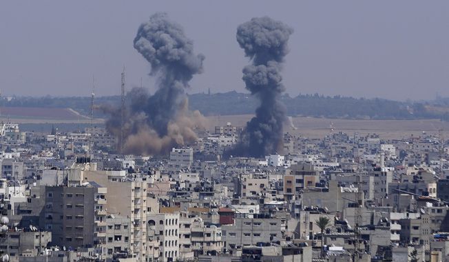 Smoke rises over the skyline following an Israeli airstrike, in Gaza, Wednesday, May 10, 2023. Palestinian militants fired dozens of rockets from the Gaza Strip into Israel on Wednesday, in a first response to Israeli airstrikes that have killed 16 Palestinians, including three senior militants and at least 10 civilians. (AP Photo/Adel Hana)