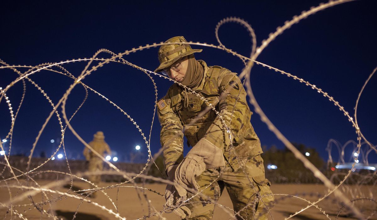 NextImg:Justices side with Biden over Texas in razor wire border fence case