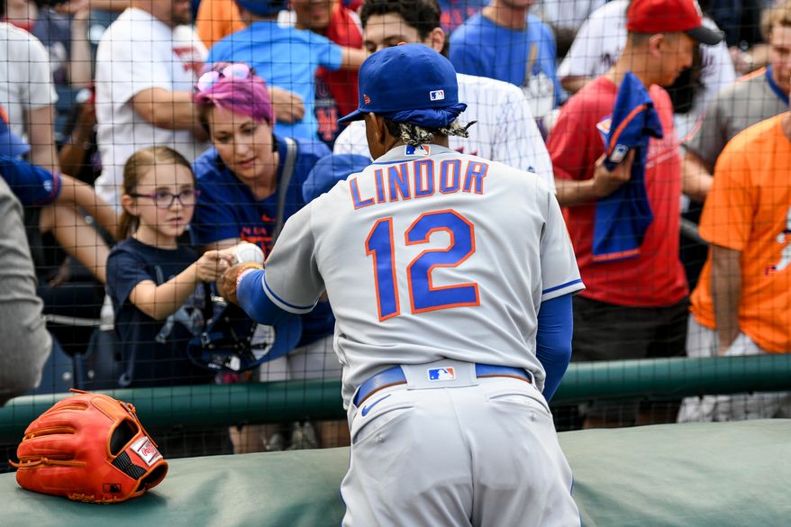 New York Mets shortstop Francisco Lindor (12) signing autographs before an MLB game against the Washington Nationals at Nationals Park in Washington D.C., May 12, 2023. (Photo by Billy Sabatini/All-Pro Reels)