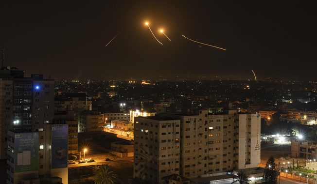 Rockets are launched from the Gaza Strip towards Israel, in Gaza City, Thursday, May 11, 2023. (AP Photo/Fatima Shbair)