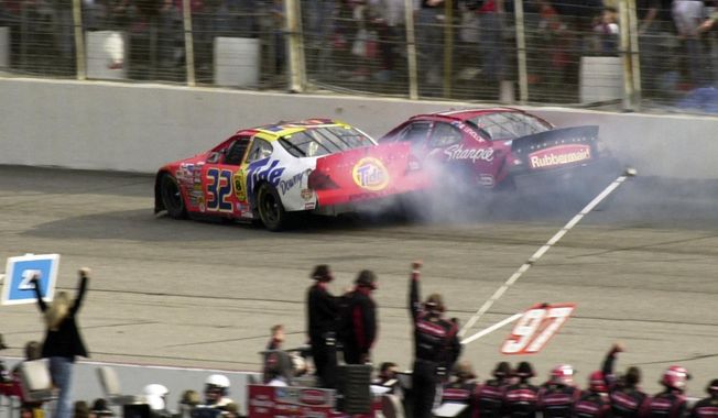 Kurt Busch, right, and Ricky Craven (32) collide after the finish line during the NASCAR Carolina Dodge Dealers 400 auto race, Sunday, March 16, 2003, at Darlington Raceway in Darlington, S.C. Craven win by 0.002 seconds after covering the last 200 yards in a metal-crunching, side-by-side duel with Busch. (AP Photo/George Gardner) **FILE**