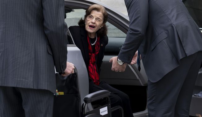 Sen. Dianne Feinstein, D-Calif., is assisted to a wheelchair by staff as she returns to the Senate after a more than two-month absence, at the Capitol in Washington, Wednesday, May 10, 2023. (AP Photo/J. Scott Applewhite)