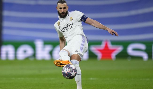 Real Madrid&#x27;s Karim Benzema passes the ball during the Champions League semifinal first leg soccer match between Real Madrid and Manchester City at the Santiago Bernabeu stadium in Madrid, Spain, Tuesday, May 9, 2023. (AP Photo/Manu Fernandez)