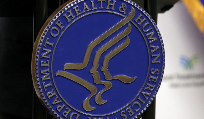 The seal for the U.S. Department of Health and Human Services is displayed in Media, Pa., Sept. 15, 2017. (AP Photo/Jacqueline Larma, File)