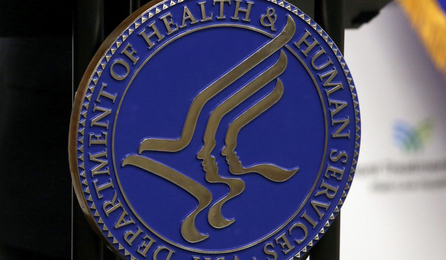The seal for the U.S. Department of Health and Human Services is displayed in Media, Pa., Sept. 15, 2017. (AP Photo/Jacqueline Larma, File)