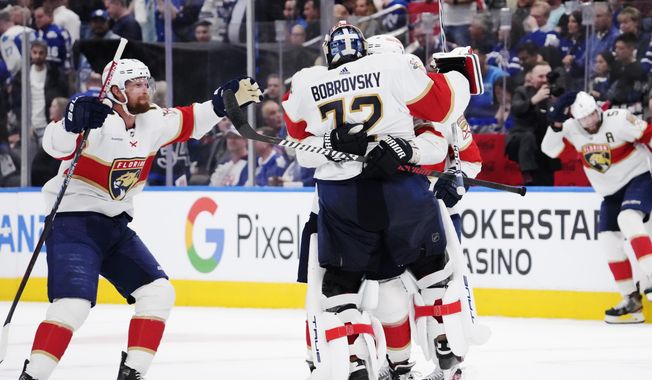 Florida Panthers goaltender Sergei Bobrovsky (72) celebrates with teammates after defeating the Toronto Maple Leafs in overtime of an NHL hockey Stanley Cup second-round playoff series Friday, May 12, 2023, in Toronto. (Frank Gunn/The Canadian Press via AP)