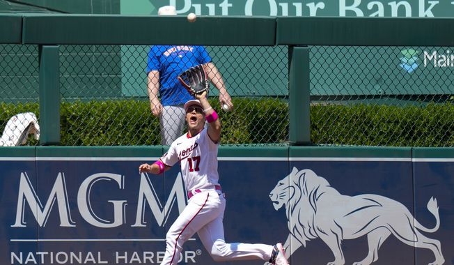 Washington Nationals center fielder Alex Call (17) catches a fly ball hit by New York Mets&#x27; Jeff McNeil for the last out of the ninth inning of the continuation of a suspended baseball game at Nationals Park, Sunday, May 14, 2023, in Washington. (AP Photo/Alex Brandon)