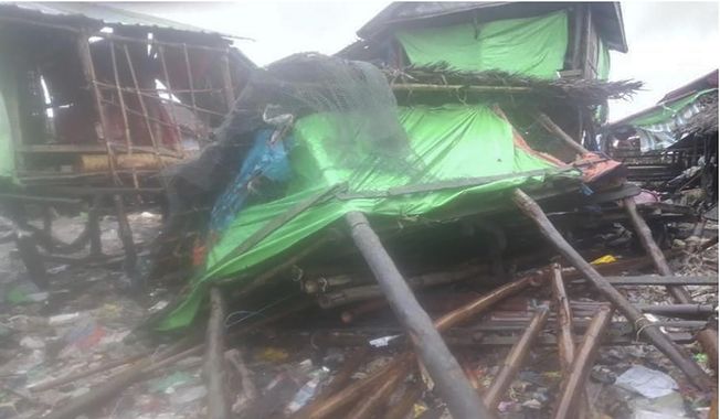 In this photo provided by Myanmar Military True News Information Team on Sunday, May 14, 2023, buildings damaged by Cyclone Mocha is seen in Kyauk Phyu township, Rakhine State. (Military True News Information Team via AP)