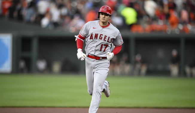 Los Angeles Angels&#x27; Shohei Ohtani rounds the bases on his three-run home run during the fourth inning of a baseball game against the Baltimore Orioles, Monday, May 15, 2023, in Baltimore. (AP Photo/Nick Wass)