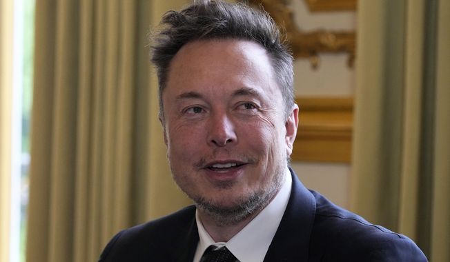Elon Musk poses prior to his talks with French President Emmanuel Macron, May 15, 2023, at the Elysee Palace in Paris. A federal appeals court says Musk cannot back out of a settlement with securities regulators over 2018 tweets claiming he had the funding to take Tesla private. The 2nd U.S. Circuit Court of Appeals in Manhattan ruled Monday, May 15, 2023, just days after hearing arguments from lawyers in the case. (AP Photo/Michel Euler, Pool/File)
