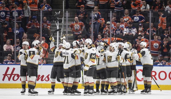 Vegas Golden Knights celebrate their win over the Edmonton Oilers in Game 6 of an NHL Stanley Cup second-round playoff hockey series in Edmonton, Alberta, Sunday, May 14, 2023. (Jason Franson/The Canadian Press via AP)