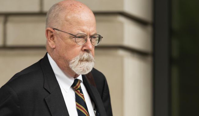 Special counsel John Durham, the prosecutor appointed to investigate potential government wrongdoing in the early days of the Trump-Russia probe, leaves federal court in Washington, May 16, 2022. Durham ended his four-year investigation into possible FBI misconduct in its probe of ties between Russia and Donald Trump’s 2016 presidential campaign. The report Monday, May 15, 2023, from Durham offers withering criticism of the bureau but a meager court record that fell far short of the former president’s prediction he would uncover the “crime of the century.” (AP Photo/Manuel Balce Ceneta, File)