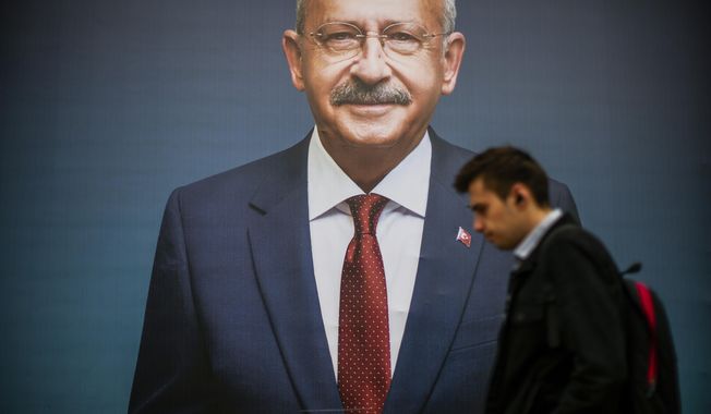 A man walks past a billboard of Turkish CHP party leader and Nation Alliance&#x27;s presidential candidate Kemal Kilicdaroglu a day after the presidential election day, in Istanbul, Turkey, Monday, May 15, 2023. Turkey&#x27;s presidential elections appeared to be heading toward a second-round runoff on Monday, with President Recep Tayyip Erdogan, who has ruled his country with a firm grip for 20 years, leading over his chief challenger, but falling short of the votes needed for an outright win. (AP Photo/Emrah Gurel)