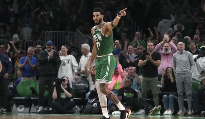 Boston Celtics forward Jayson Tatum (0) celebrates during the second half of Game 7 against the Philadelphia 76ers in the NBA basketball Eastern Conference semifinals playoff series, Sunday, May 14, 2023, in Boston. (AP Photo/Steven Senne)