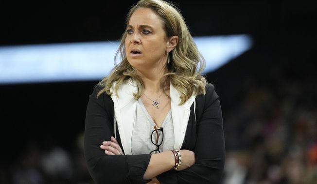 Las Vegas Aces head coach Becky Hammon looks on during a WNBA game against the Dallas Wings Sunday, June 5, 2022, in Las Vegas. The WNBA suspended Las Vegas Aces coach Becky Hammon for two games without pay Tuesday, May 16, 2023, for violating league and team respect in the workplace policies. The violation was related to comments made by Hammon to Dearica Hamby in connection with the player&#x27;s recent pregnancy. (AP Photo/John Loche) **FILE**