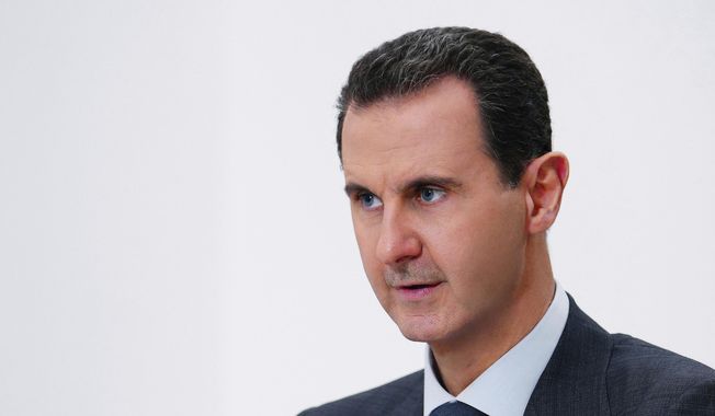 In this photo released on Nov. 9, 2019, by the Syrian official news agency SANA, Syrian President Bashar Assad speaks in Damascus, Syria. Syria&#x27;s embattled President Bashar Assad has received late Monday, May 15, 2023, an invitation to attend the upcoming COP28 climate talks in Dubai later this year, even as the yearslong war in his country over his rule grinds on. (SANA via AP, File)