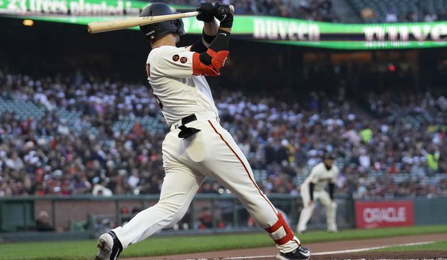 San Francisco Giants&#x27; Michael Conforto hits a three-run home run during the second inning of a baseball game against the Philadelphia Phillies in San Francisco, Monday, May 15, 2023. (AP Photo/Jeff Chiu)