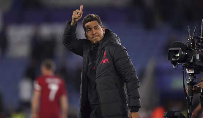 Liverpool&#x27;s Roberto Firmino gestures to the crowd after the English Premier League soccer match between Leicester City and Liverpool at the King Power Stadium, Leicester, England, Monday May 15, 2023. (Tim Goode/PA via AP)