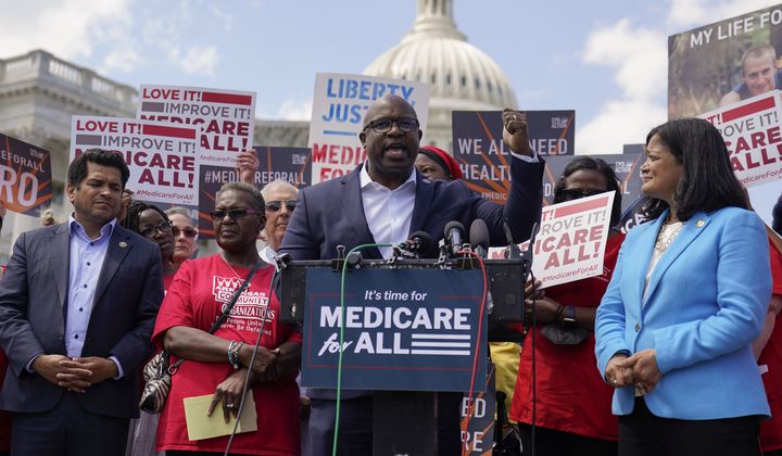 Rep. Jamaal Bowman, D-N.Y., joined by Rep. Jimmy Gomez, D-Calif., left, and Rep. Pramila Jayapal, D-Wash., right, speaks during a news conference on Capitol Hill in Washington, Wednesday, May 17, 2023, about Medicare for All. (AP Photo/Carolyn Kaster)