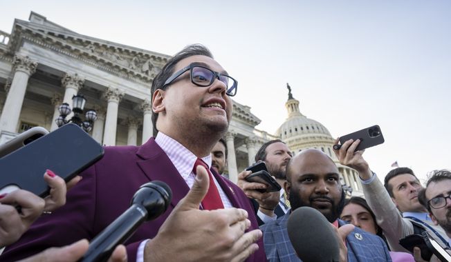 Rep. George Santos, R-N.Y., speaks to reporters outside after an effort to expel him from the House, at the Capitol in Washington, Wednesday, May 17, 2023. The freshman congressman has been charged with embezzling money from his campaign, falsely receiving unemployment funds and lying to Congress about his finances. He has denied the charges and has pleaded not guilty. (AP Photo/J. Scott Applewhite)