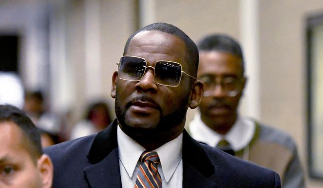 R. Kelly leaves the Daley Center after a hearing in his child support case May 8, 2019, in Chicago. Minnesota prosecutors dropped sex abuse charges on Tuesday, May 16, 2023, against disgraced R&amp;B superstar R. Kelly that alleged he invited a 17-year-old girl to his hotel room in 2001 and paid her $200 to dance naked with him. (AP Photo/Matt Marton, File)