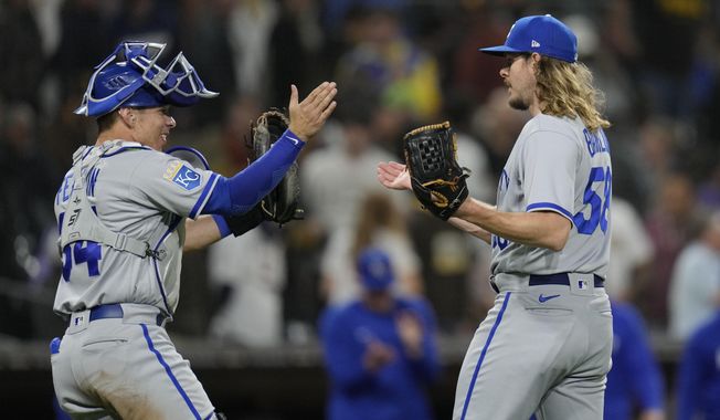 Kansas City Royals relief pitcher Scott Barlow celebrates with teammate catcher Freddy Fermin after the Royals defeated the San Diego Padres 5-4 in a baseball game Tuesday, May 16, 2023, in San Diego. (AP Photo/Gregory Bull)